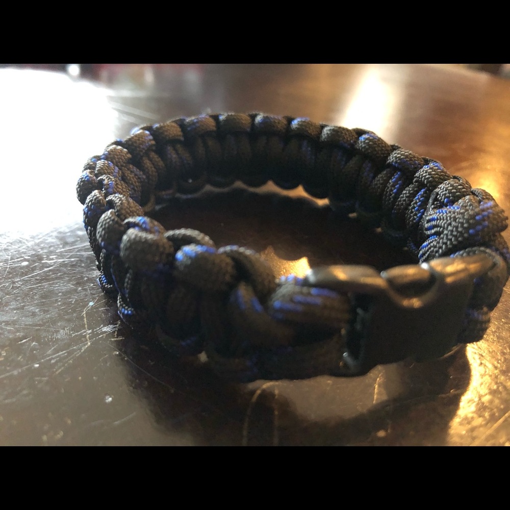 A navy blue and black paracord rope bracelet
